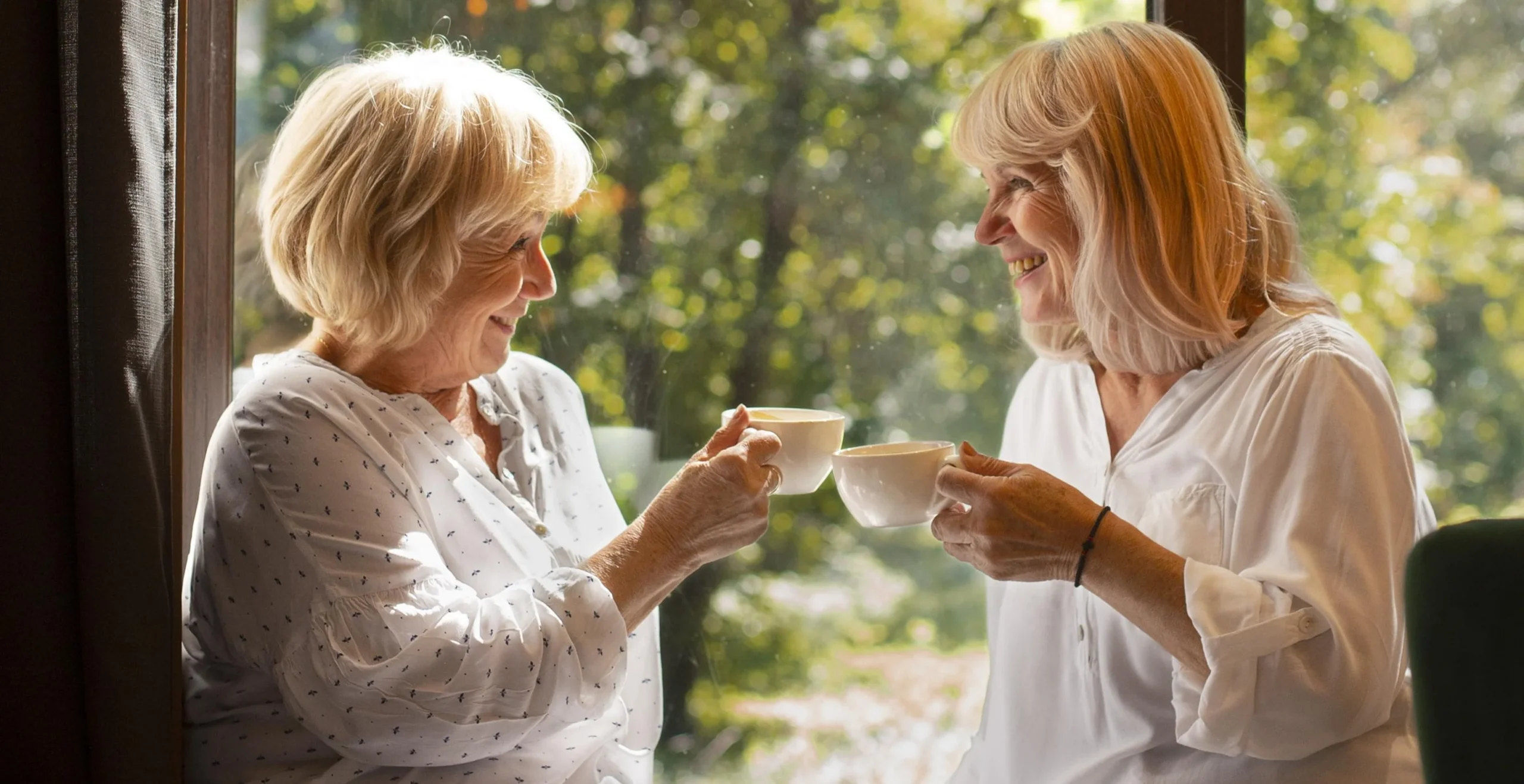 Two women having a conversation over tea