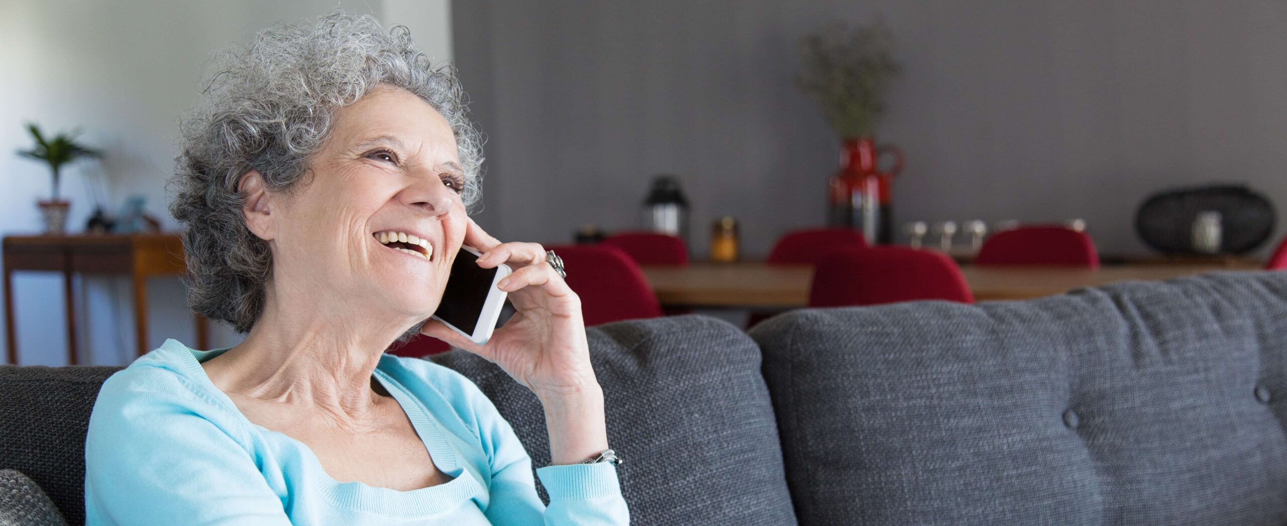 Happy woman talking on phone