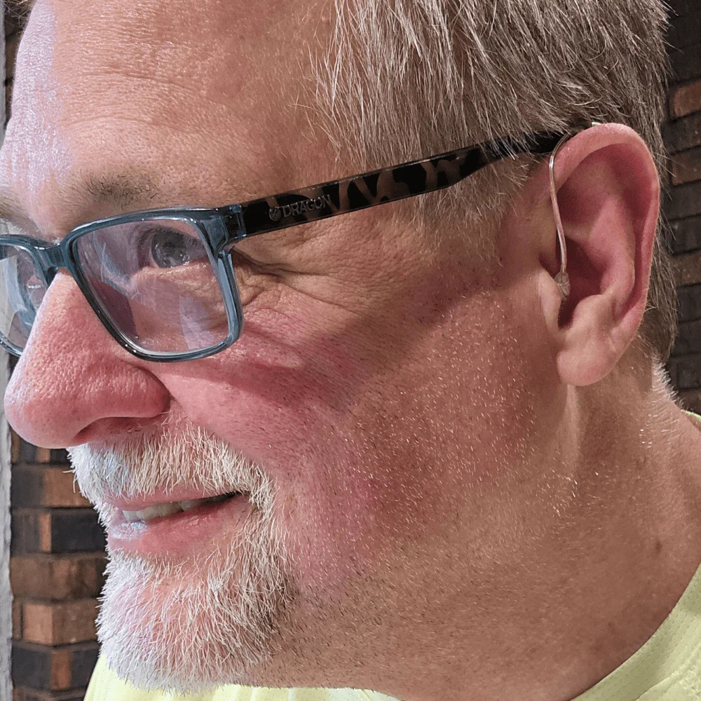 Man wearing TruHear discreet hearing aid